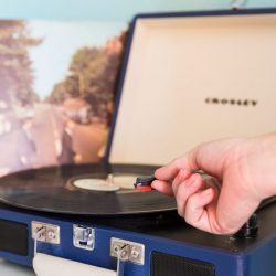 Rambler: record player with hand putting the needle on