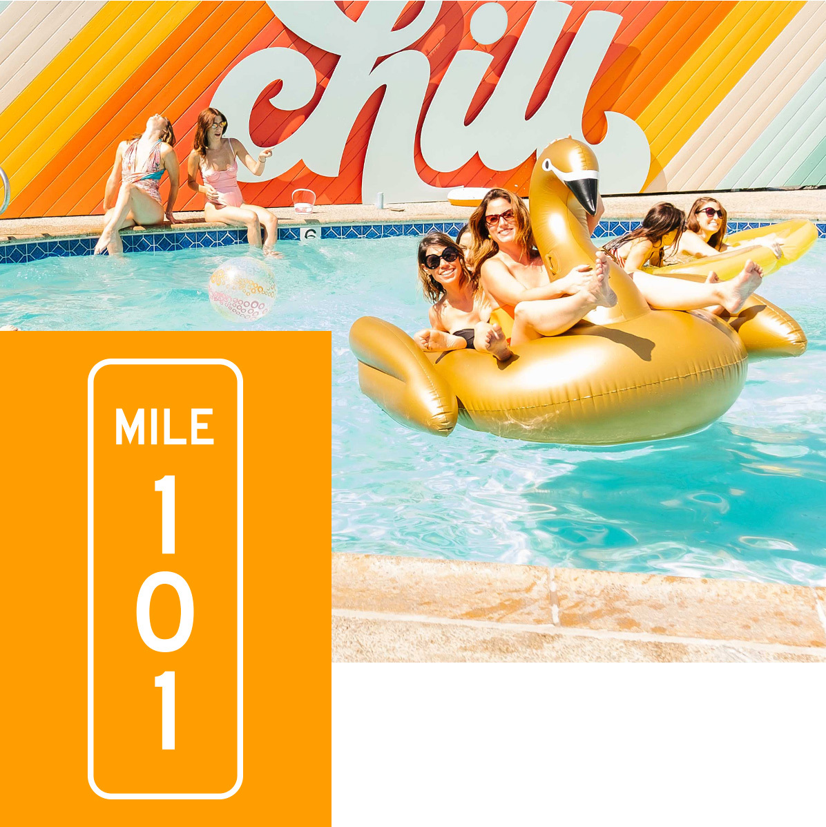 Girls hanging out in the pool and by the CHILL artwork sign. Mile Marker 101 displayed.