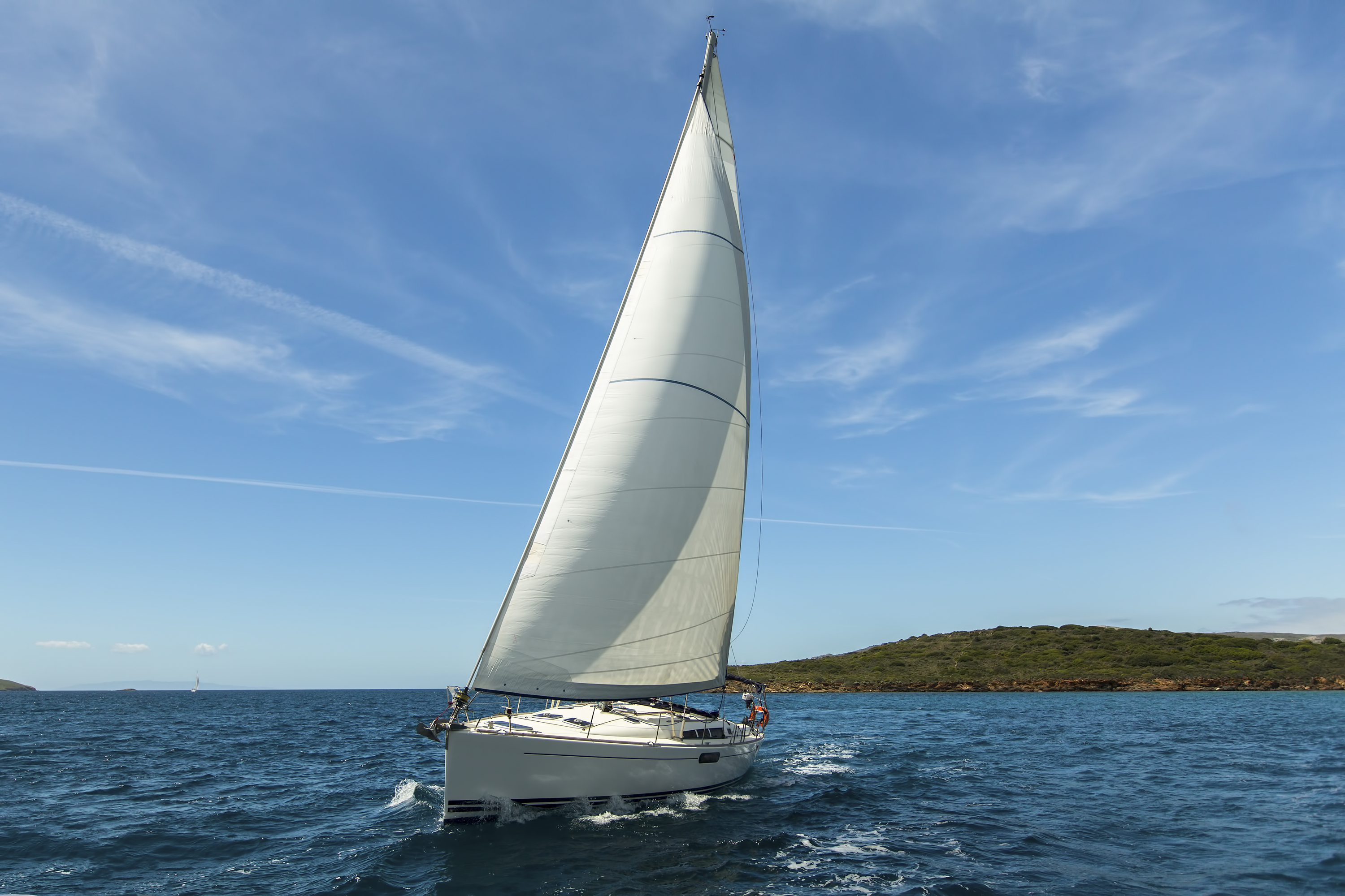 Sailing ship yachts with white sails in the Aegean Sea.