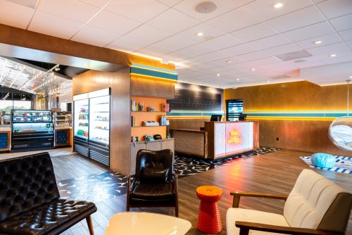 Lobby of The Rambler Motel with view of check in desk and chairs in waiting area