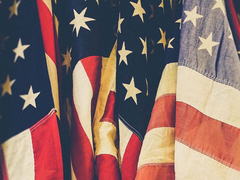 Upclose shot of vintage looking American flags
